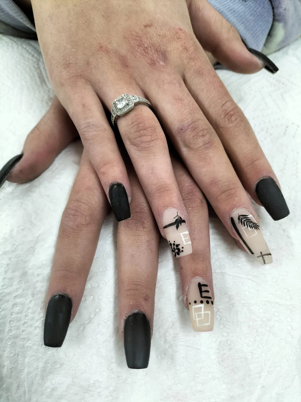 Nails done at Neon Moon Nail & Beauty, Sasolburg: matte black coffins with fine line art
