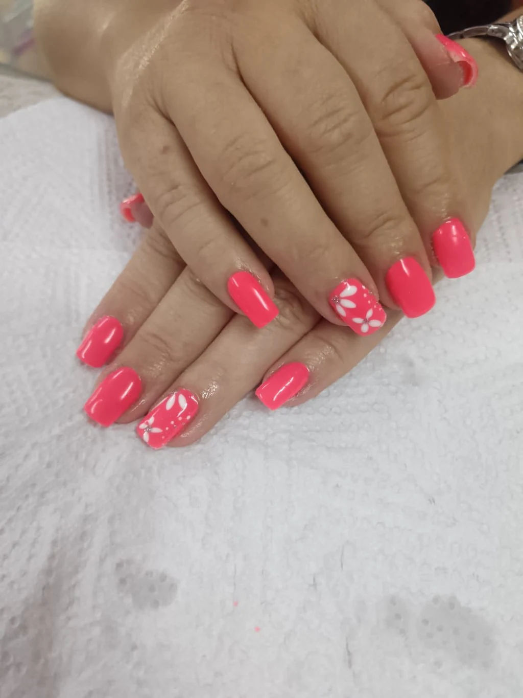 Nails done at Neon Moon Nail & Beauty, Sasolburg: bright pink with one flower accent