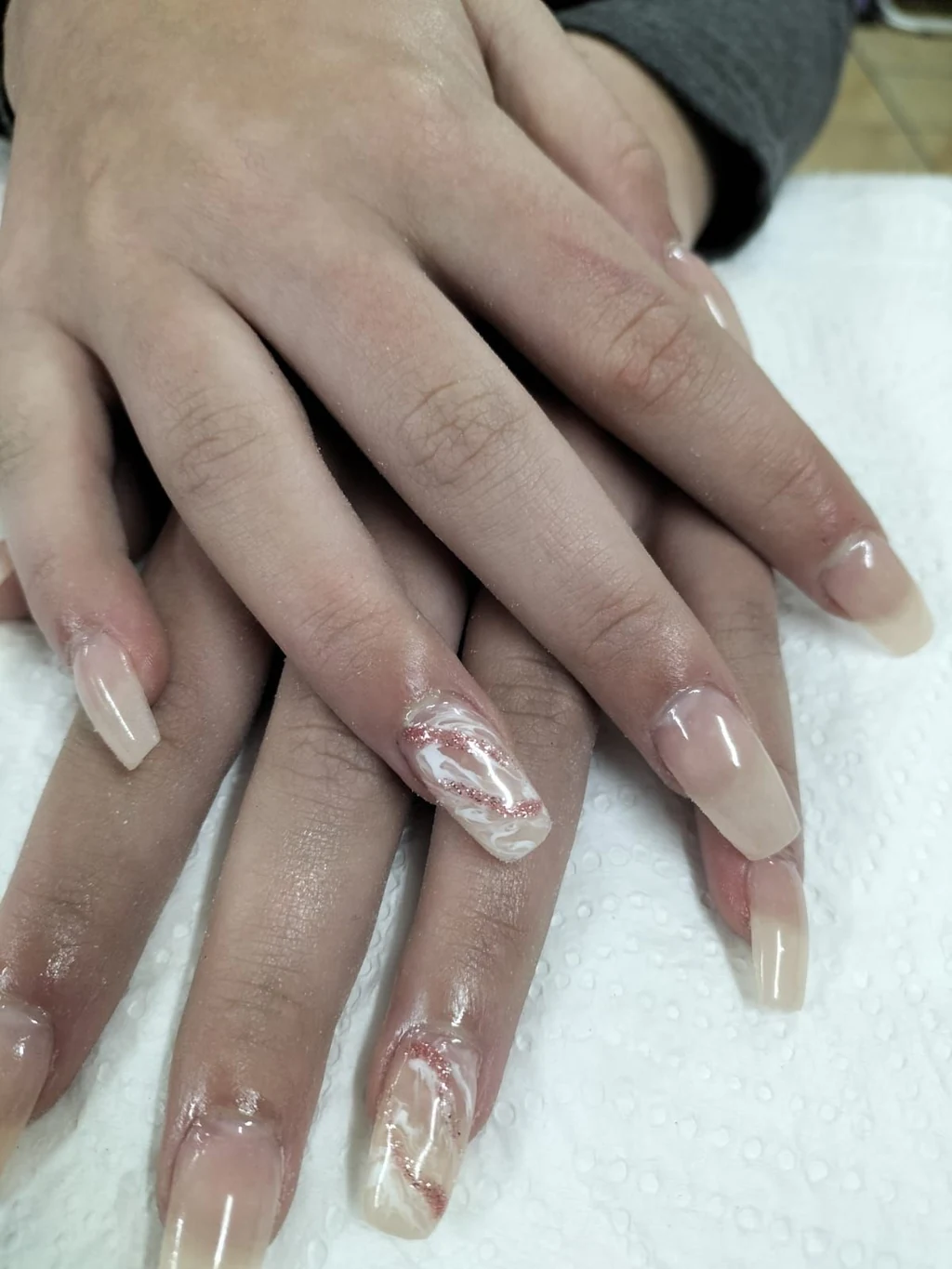 Nails done at Neon Moon Nail & Beauty, Sasolburg: long nude coffins, white marble accent